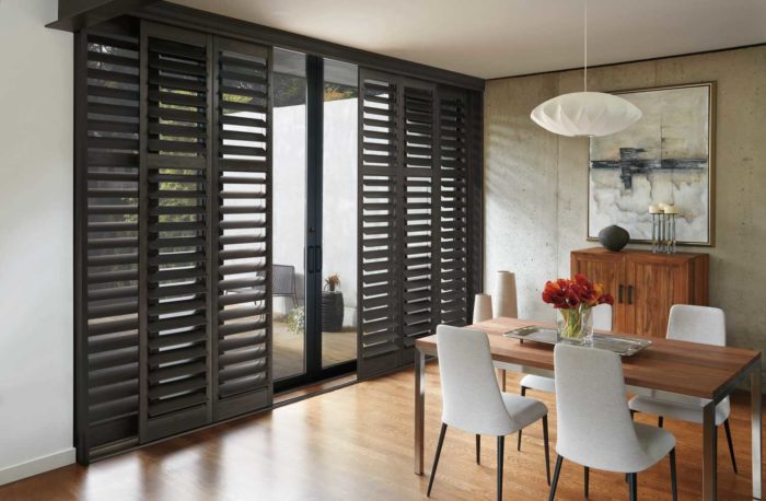 shutters separating dining space from outside