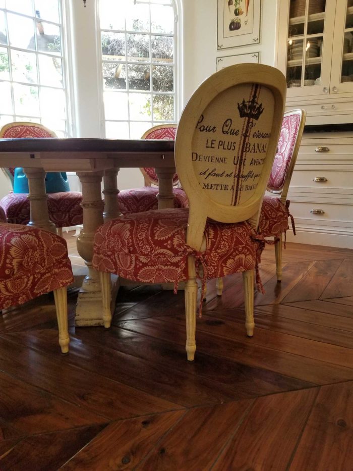 Chair seat slipcover on chairs around a dining table