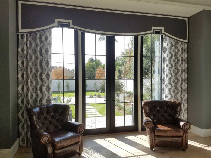 How to care for your curtains in Gilbert - Cornice Box with drapes over large french windows in the living room