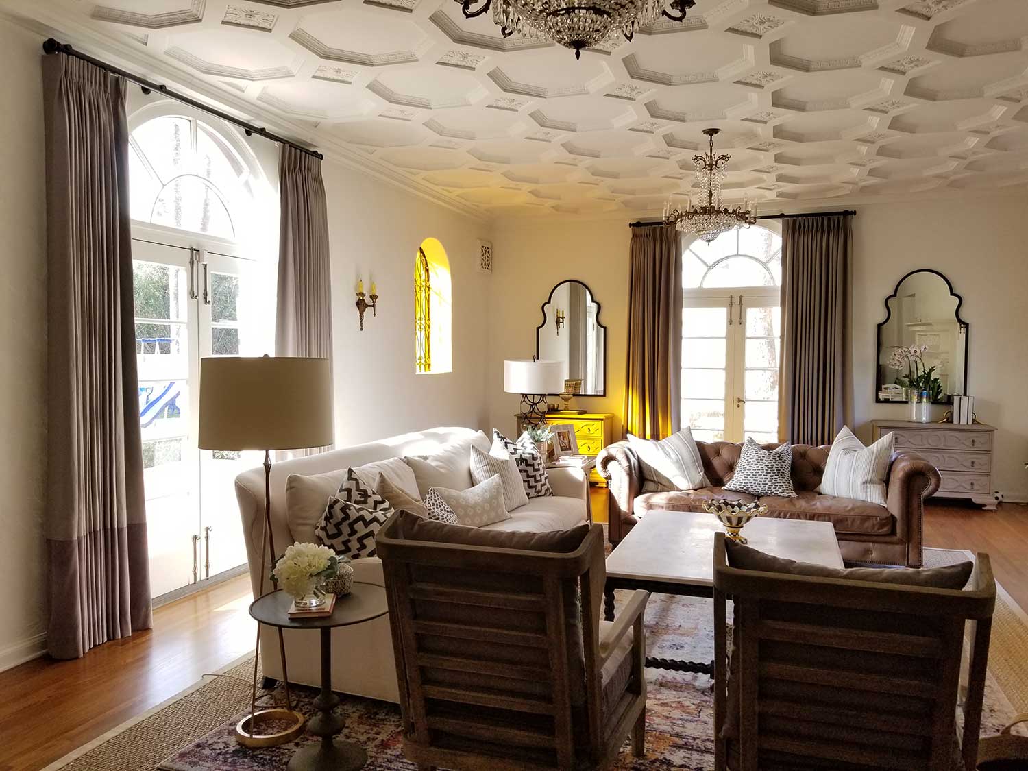 A living room with a honey comb patterned ceiling