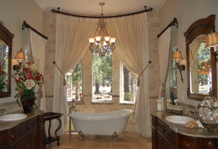 ornately decorated bathroom with three curved windows