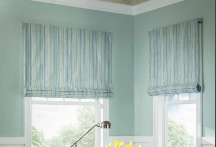 Flat Fold Roman Shade over two windows in a room corner