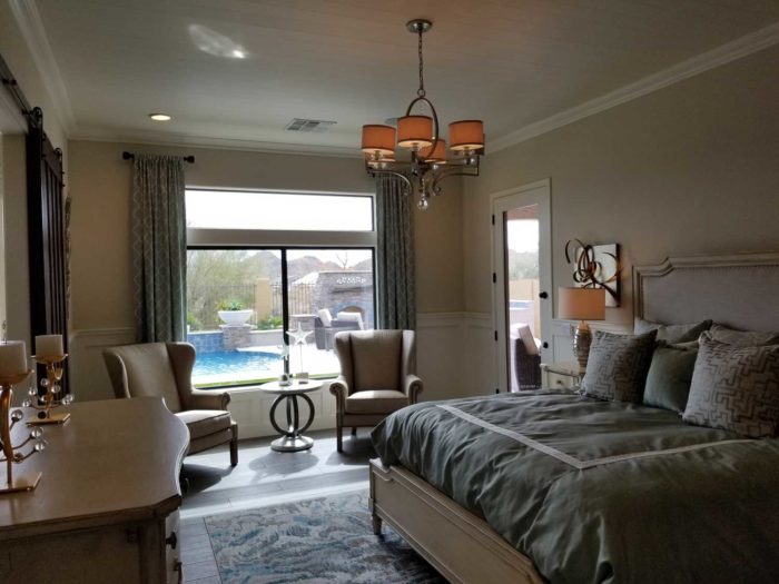 bedroom with window overlooking a pool