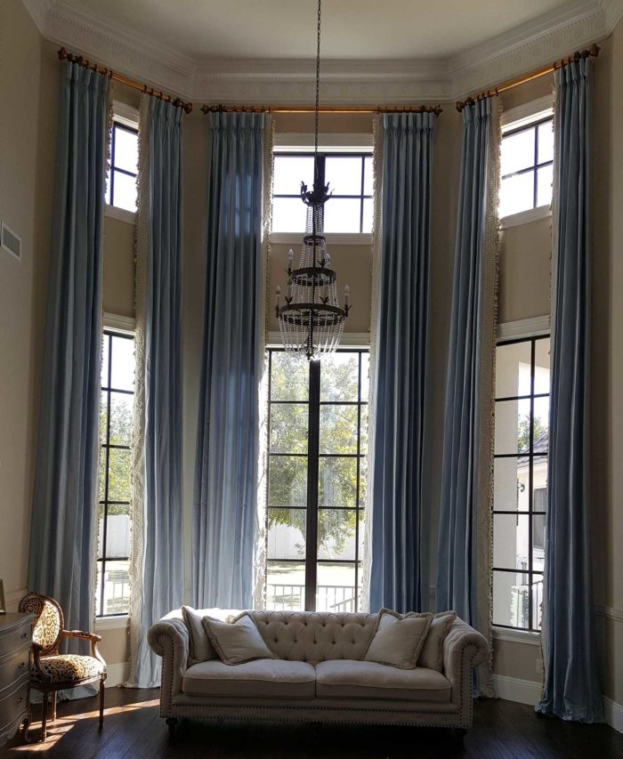 large, angled windows in a corner of a living room