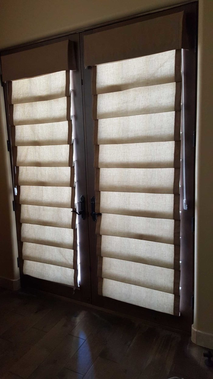 Hobbled Roman Shades over a window