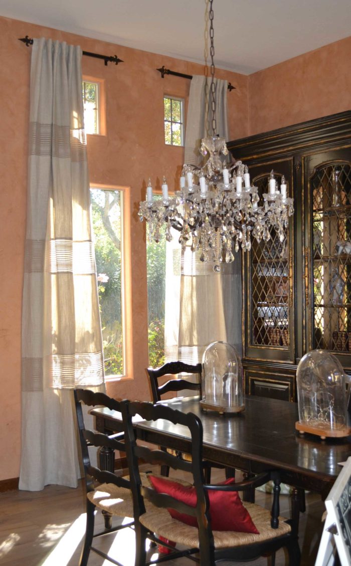 dining space with dining table, windows and side shelves