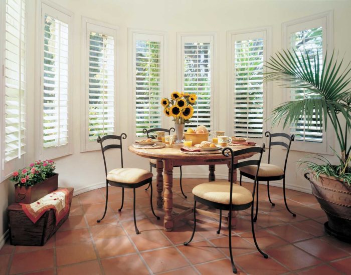 shutters in gilbert, az - shuttered, circular windows around a dining space