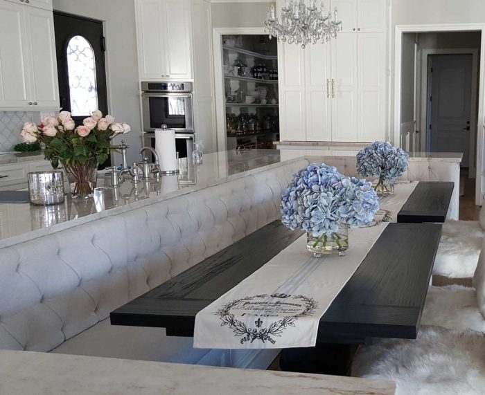 Tufted Bench Seating in dining area next to kitchen area