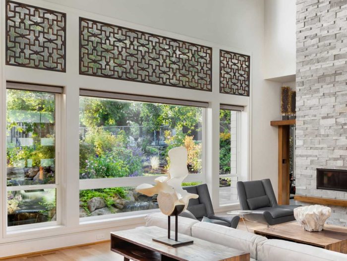 living space with wide window-views into a green garden