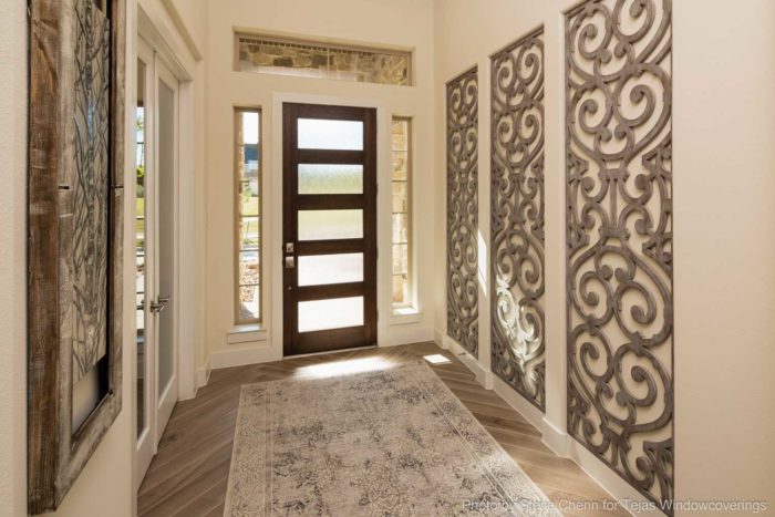 hallway with metalwork on the walls