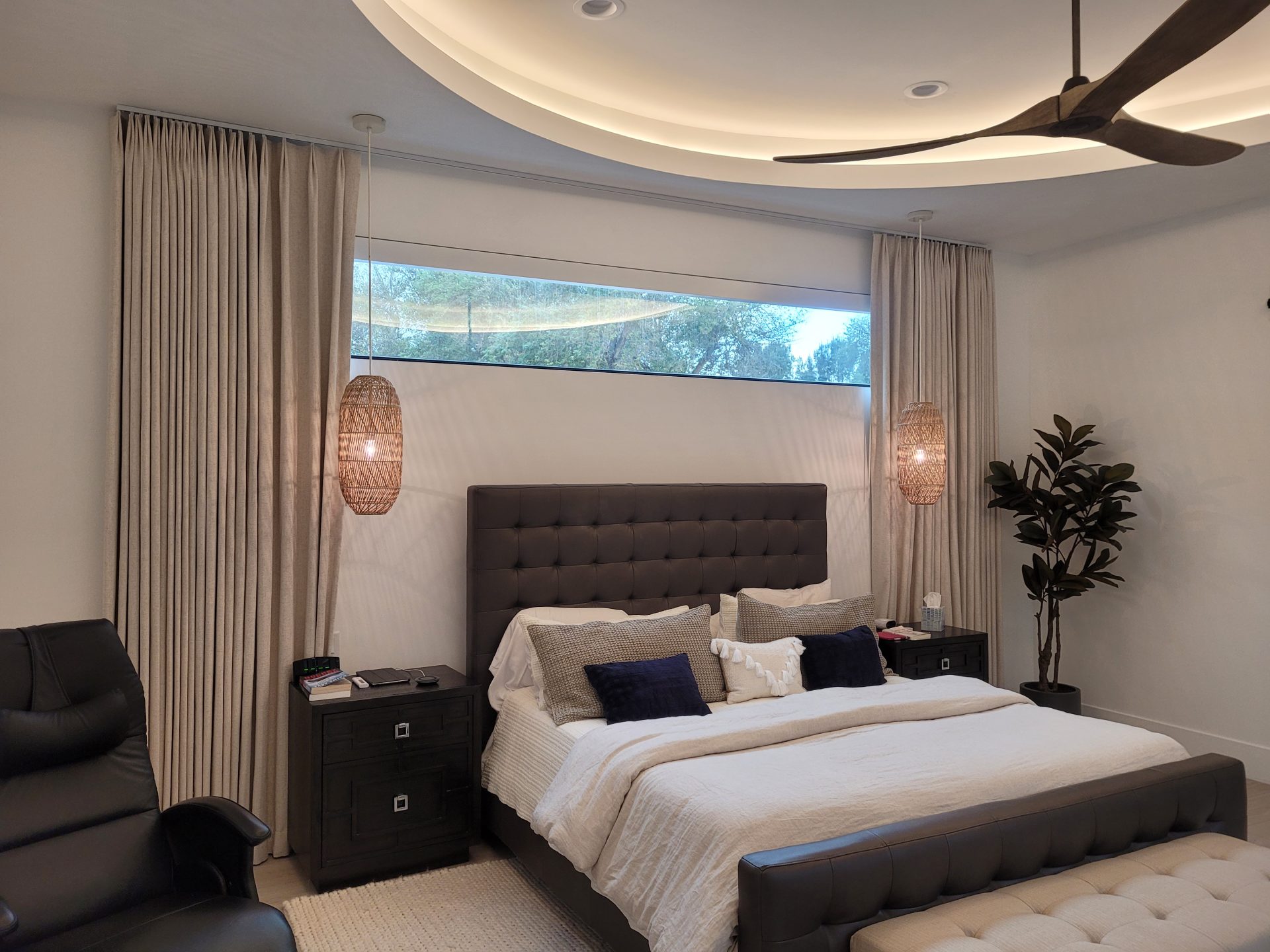 Ceiling-Mounted Drapes Behind the Bed