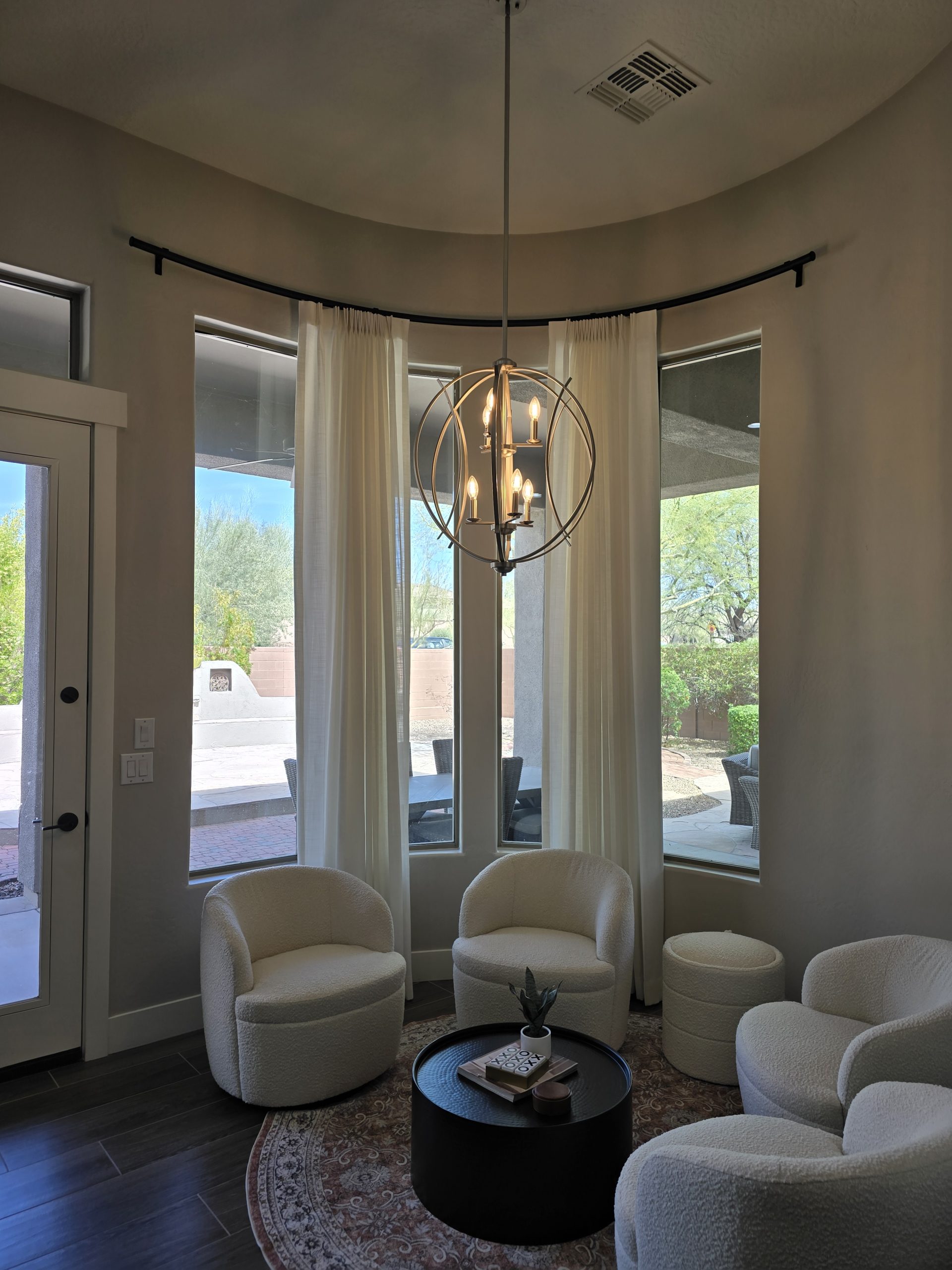 Curved Rod with drapery stacking to the center walls